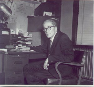 Dr. Martin sitting at his desk.